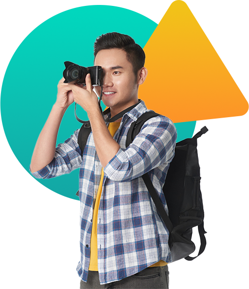 Young man with a camera representing IMPACT, a video marketing agency in Singapore delivering creative video production services.