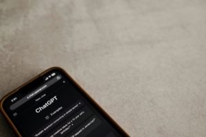 Smartphone displaying the ChatGPT interface on a desk, representing the role of AI in modern SEO and content optimisation.