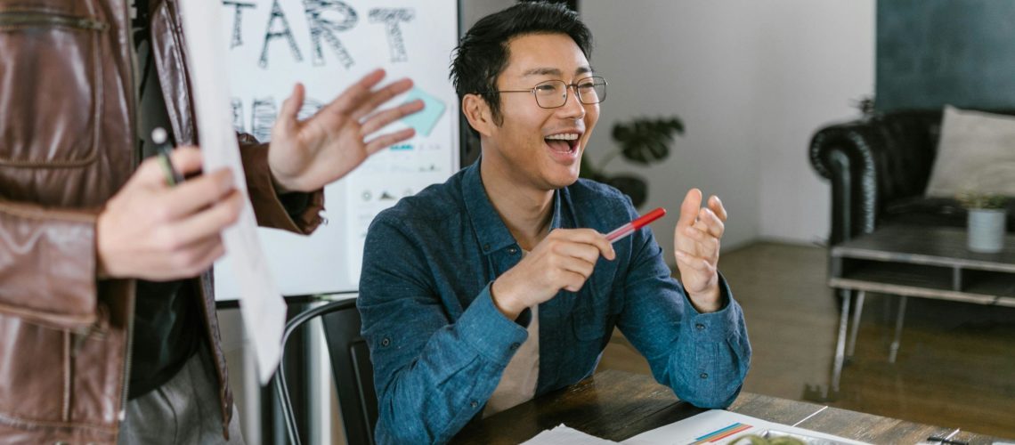 Team members collaborating during a strategy session, showcasing the energy and creativity supported by a full service marketing agency in Singapore.
